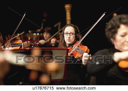Stock Photography - String section in orchestra. Fotosearch