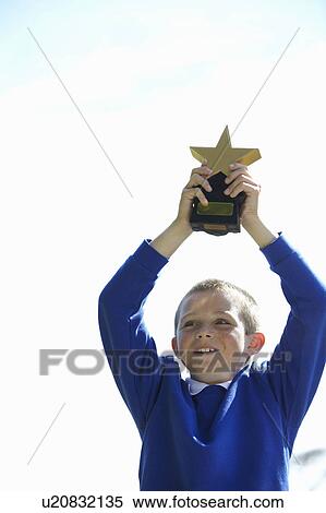 Student cheering with trophy View Large Photo Image Stock Photography - Student cheering with trophy. Fotosearch