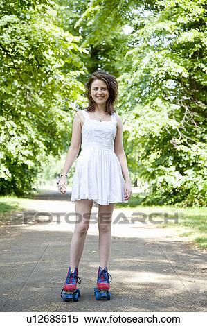 Teenage girl in roller skates in park View Large Photo Image Stock Photography - Teenage girl in roller skates in park. Fotosearch