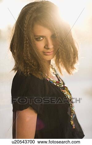 Teenage girl smiling outdoors View Large Photo Image Stock Image - Teenage girl smiling outdoors. Fotosearch