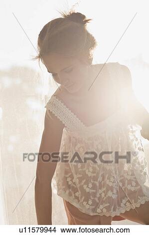 Teenage girl wearing sheer dress View Large Photo Image Picture - Teenage girl wearing sheer dress. Fotosearch