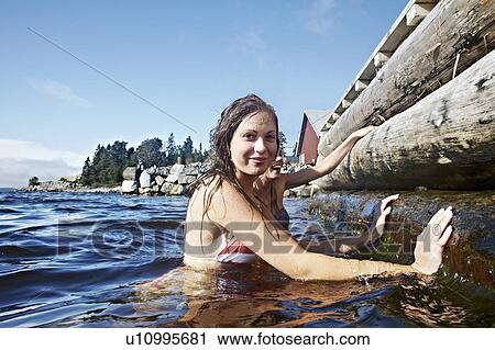 Teenage girls climbing pier View Large Photo Image Stock Image - Teenage girls climbing pier. Fotosearch