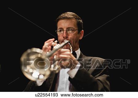 Trumpet player in orchestra View Large Photo Image Stock Image - Trumpet player in orchestra. Fotosearch