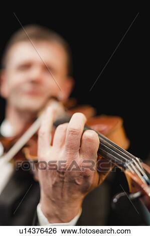 Violin player in orchestra View Large Photo Image Stock Photograph - Violin player in orchestra. Fotosearch