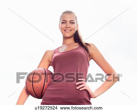Woman carrying basketball outdoors View Large Photo Image Picture - Woman carrying basketball outdoors. Fotosearch
