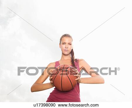 Woman holding basketball outdoors View Large Photo Image Stock Image - Woman holding basketball outdoors. Fotosearch