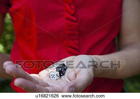Woman holding dice in hand View Large Photo Image Stock Photograph - Woman holding dice in hand. Fotosearch