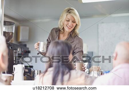 Woman serving coffee in food cart View Large Photo Image Stock Photo - Woman serving coffee in food cart. Fotosearch