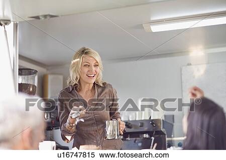 Woman serving coffee in food cart View Large Photo Image Stock Photography - Woman serving coffee in food cart. Fotosearch
