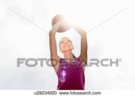 Woman shooting basketball View Large Photo Image Stock Image - Woman shooting basketball. Fotosearch