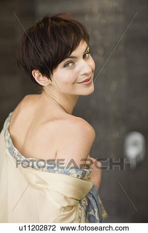 Woman wearing sheer robe in bathroom View Large Photo Image Stock Image - Woman wearing sheer robe in bathroom. Fotosearch
