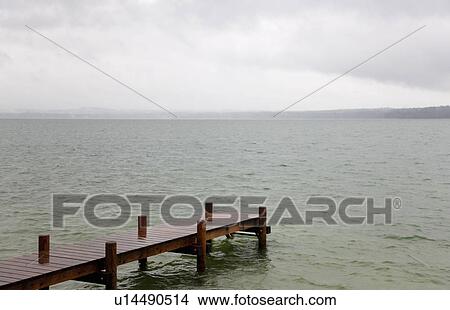 Picture - Wooden dock stretching into lake. Fotosearch