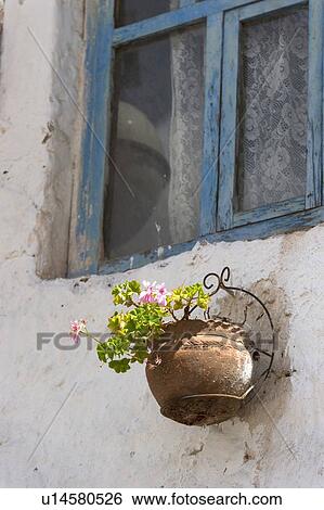 A Flower Pot Mounted On An Exterior Wall Below A Window; Barrio De San Blas; Cusco Peru View Large Photo Image Stock Photograph - A Flower Pot Mounted On An Exterior Wall Below A Window; Barrio De San Blas; Cusco Peru. Fotosearch