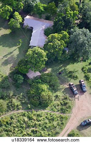 Aerial view of Rekero Camp with tent accommodation safari jeeps parked, Masai Mara, Kenya, East Africa View Large Photo Image Picture - Aerial view of Rekero Camp with tent accommodation safari jeeps parked, Masai Mara, Kenya, East Africa. Fotosearch