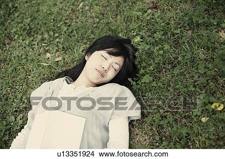 Picture - A young woman in the forest. Fotosearch
