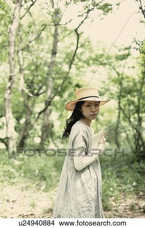 A young woman in the forest View Large Photo Image Picture - A young woman in the forest. Fotosearch