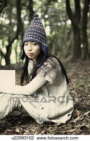 A young woman in the forest View Large Photo Image Stock Image - A young woman in the forest. Fotosearch