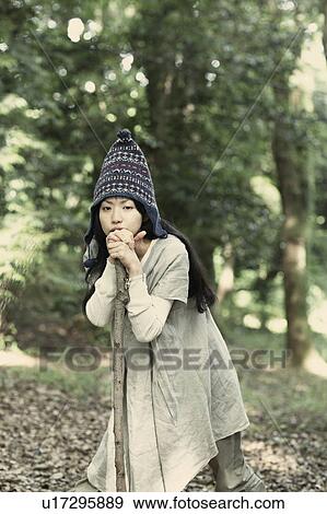 A young woman in the forest View Large Photo Image Stock Photo - A young woman in the forest. Fotosearch