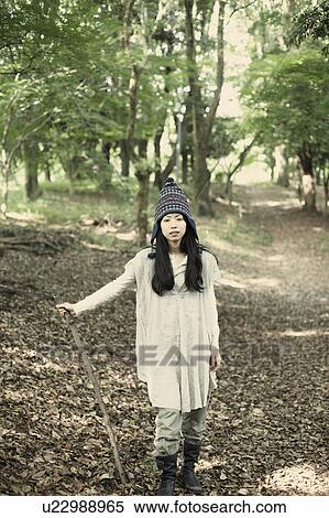 Stock Photography - A young woman in the forest. Fotosearch