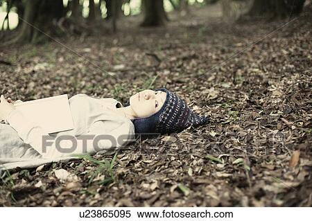 Stock Photography - A young woman in the forest. Fotosearch