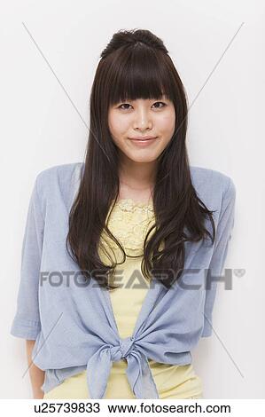 A young woman smiling View Large Photo Image Stock Image - A young woman smiling. Fotosearch