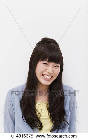 Stock Photography - A young woman smiling. Fotosearch