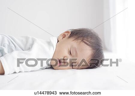 Stock Image - Baby Boy Sleeping. Fotosearch