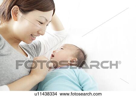 Picture - Baby Girl and Mother Looking at Each Other. Fotosearch
