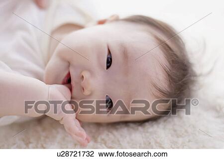 Baby sucking finger View Large Photo Image Stock Image - Baby sucking finger. Fotosearch