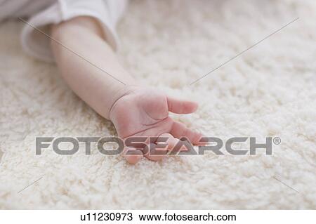 Stock Image - Baby's hand. Fotosearch