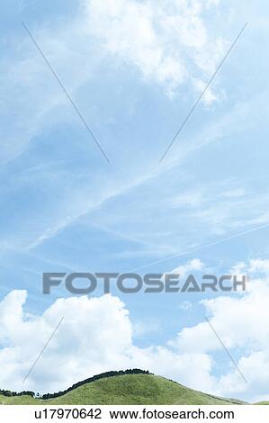 Stock Image - Blue Sky Over Hill. Fotosearch