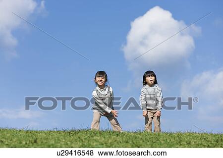Stock Photo - Boy and Girl in Field. Fotosearch