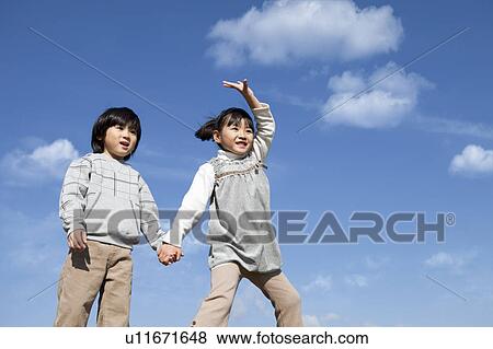 Boy and Girl Jumping View Large Photo Image Stock Photo - Boy and Girl Jumping. Fotosearch