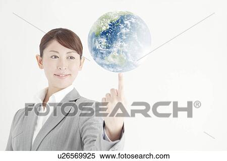 Stock Photography - Busiensswoman Balancing Earth on Fingertip. Fotosearch