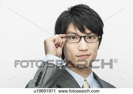 Businessman Adjusting Glasses View Large Photo Image Stock Image - Businessman Adjusting Glasses. Fotosearch