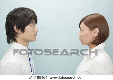Businessman and Businesswoman Looking At Each Other View Large Photo Image Picture - Businessman and Businesswoman Looking At Each Other. Fotosearch