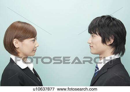 Businessman and Businesswoman Looking At Each Other View Large Photo Image Stock Photo - Businessman and Businesswoman Looking At Each Other. Fotosearch