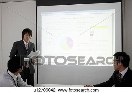 Stock Image - Businessman Giving Presentation. Fotosearch