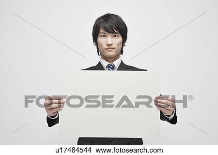 Businessman Holding Blank Message View Large Photo Image Picture - Businessman Holding Blank Message. Fotosearch