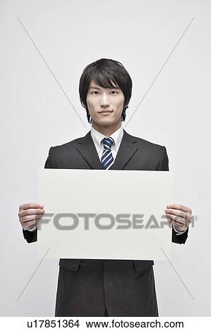 Picture - Businessman Holding Blank Message. Fotosearch