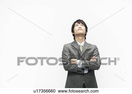 Stock Image - Businessman Looking Up. Fotosearch