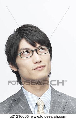 Stock Photography - Businessman Looking Up. Fotosearch