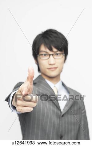 Stock Photo - Businessman Pointing At Camera. Fotosearch