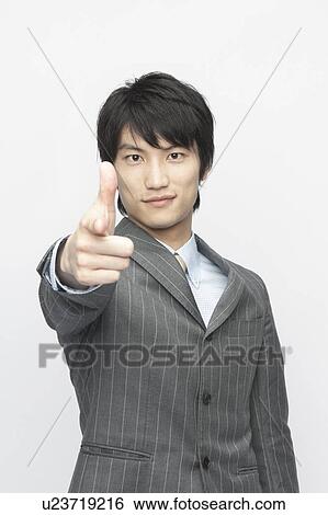 Stock Photograph - Businessman Pointing at Camera. Fotosearch