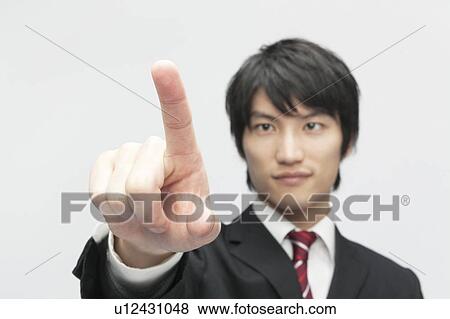 Stock Photo - Businessman Pointing. Fotosearch