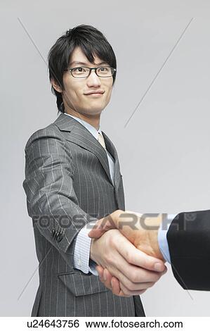 Businessman Shaking Hands with Colleague View Large Photo Image Stock Photograph - Businessman Shaking Hands with Colleague. Fotosearch