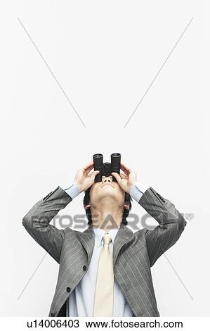 Stock Image - Businessman Through Binoculars. Fotosearch