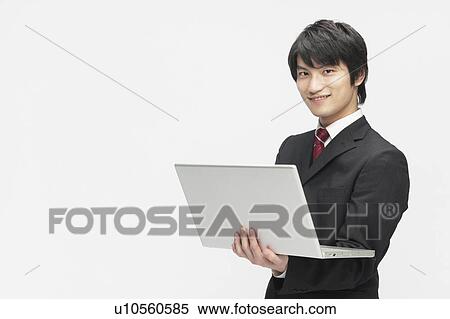 Stock Photography - Businessman Using Laptop. Fotosearch
