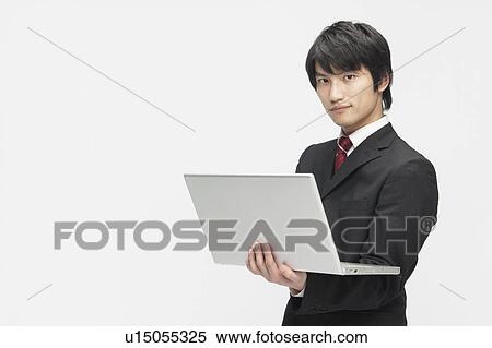 Stock Photography - Businessman Using Laptop. Fotosearch