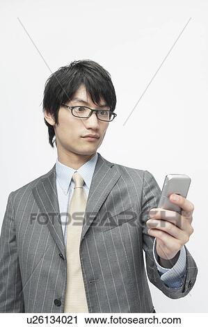 Stock Image - Businessman Using Mobile Phone. Fotosearch
